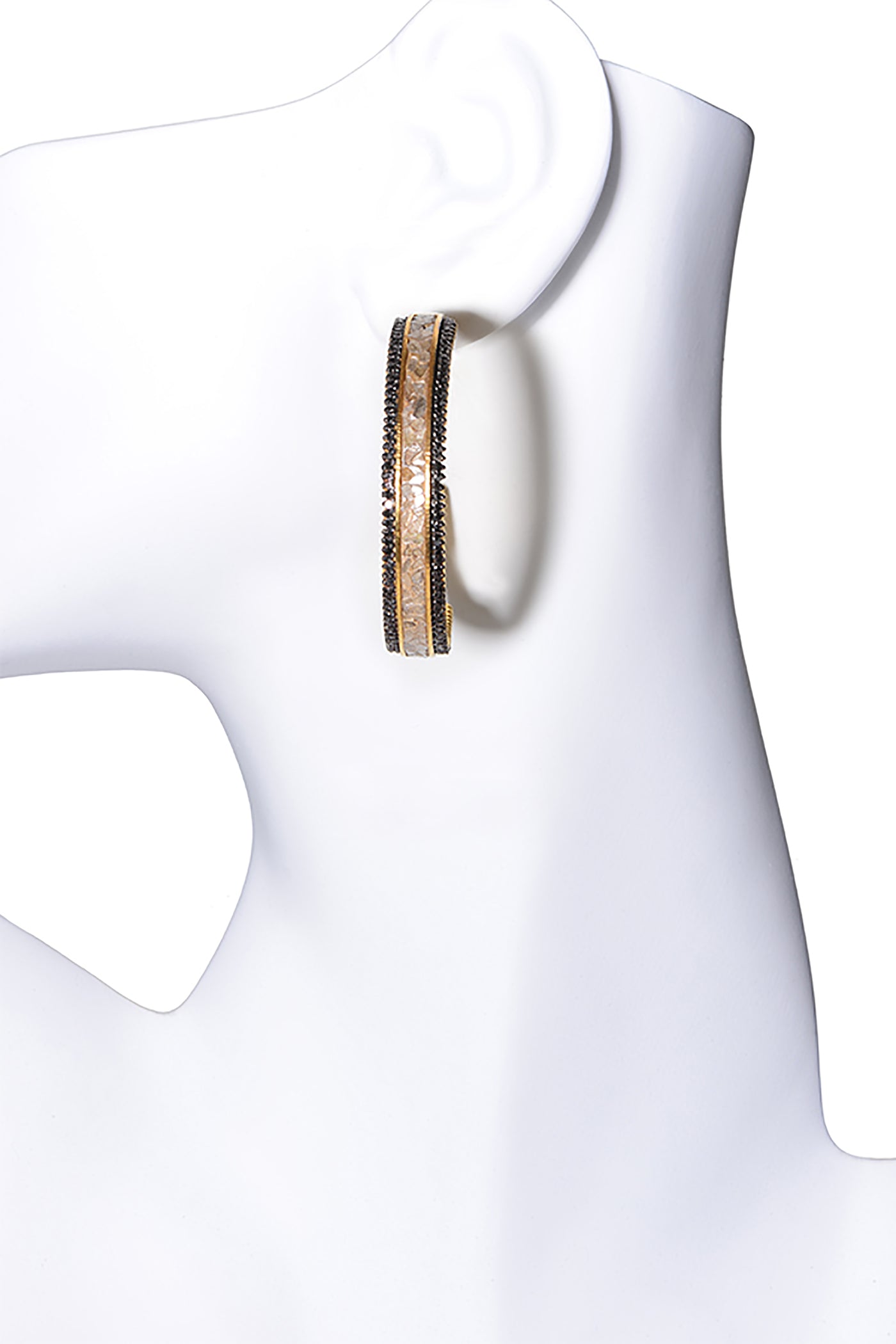 gold diamond hoop earrings on mannequin