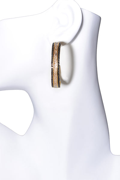 gold diamond hoop earrings on mannequin