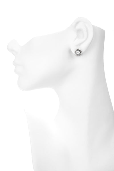 flower shaped diamond silver studs on mannequin